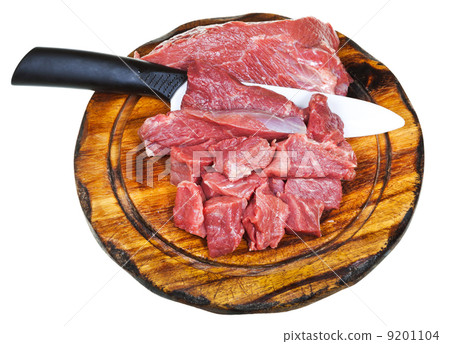 top view of cut raw meat on wooden board 9201104