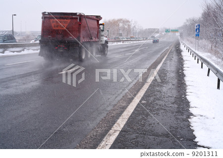 truck on highway in snowy day truck on highway in snowy day 9201311