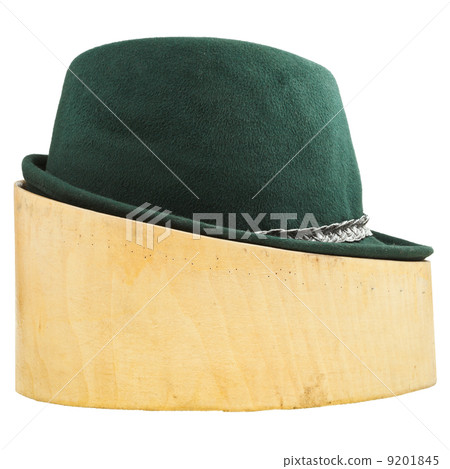 green tyrolean felt hat on linden wood block 9201845