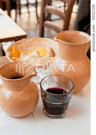 rural ceramic jugs with local red wine 9202106