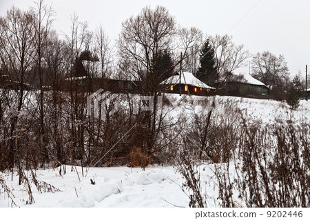 snowed village in winter evening snowed village in winter evening 9202446