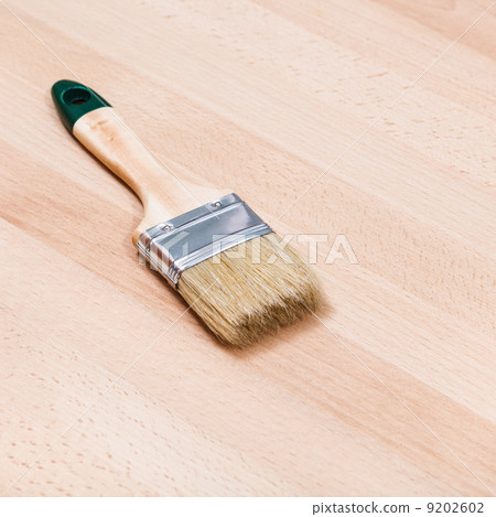 paint brush on beech wooden board paint brush on beech wooden board 9202602