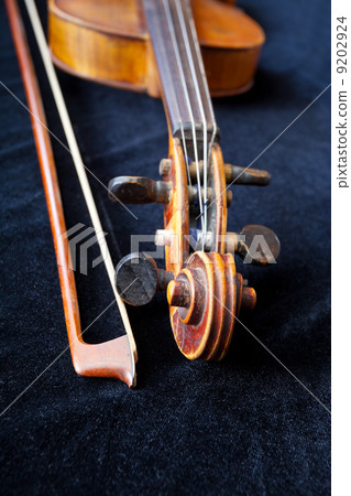 violin scroll and bow on black velvet violin scroll and bow on black velvet 9202924