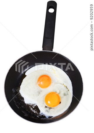 fried eggs in frying pan isolated on white 9202959