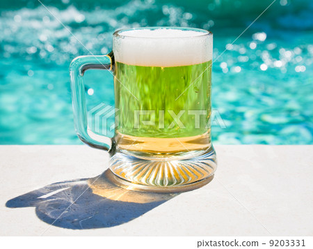 glass of cold beer in hot summer day glass of cold beer in hot summer day 9203331