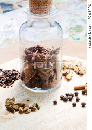 old glass bottle with spices 9203608