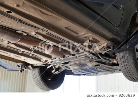 car lifted on auto hoist at service station 9203629