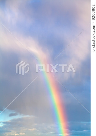 rainbow in blue cloudy autumn sky 9203902