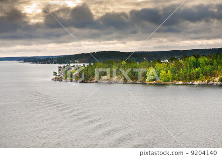 small stone islands in swedish fiord at sunset 9204140
