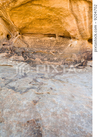 Petroglyphs on sandstone rock in Wadi Rum desert Petroglyphs on sandstone rock in Wadi Rum desert 9204702