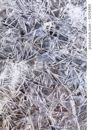 ice crystals under frozen puddle ice crystals under frozen puddle 9204860