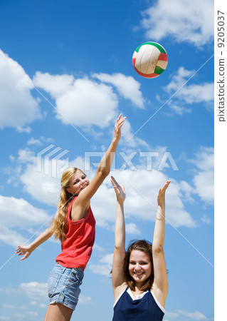 girls playing volleyball girls playing volleyball 9205037