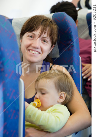 Family traveling on commercial airliner 9205231