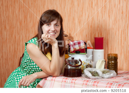 Happy woman with herbs 9205518