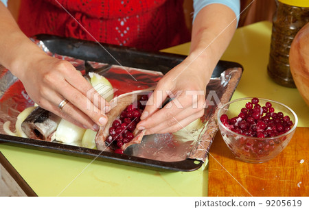 cook making mackerel with cranberries 9205619