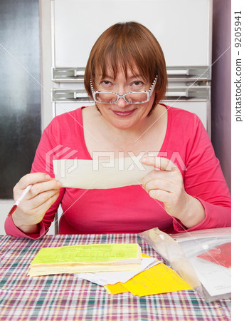 mature woman with utility bills mature woman with utility bills 9205941