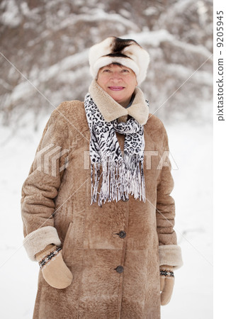 mature woman in wintry forest mature woman in wintry forest 9205945