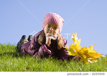 Girl on grass against sky 9205949