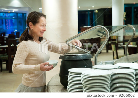 Woman looking the soup Woman looking the soup 9206002