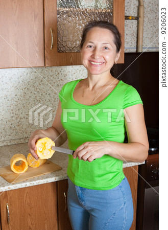 woman making stuffed vegetable marrow woman making stuffed vegetable marrow 9206023