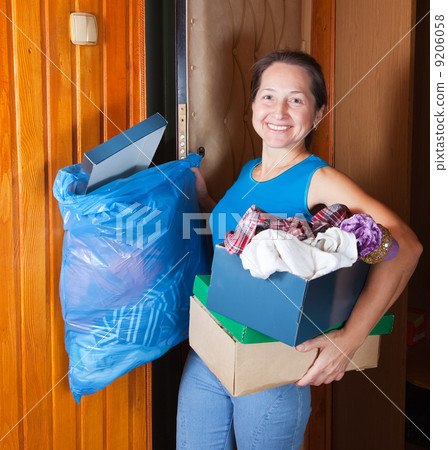 woman putting out the garbage woman putting out the garbage 9206058