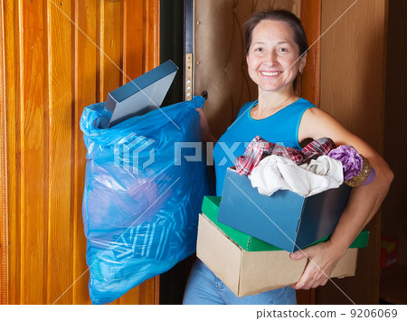 woman taking away the garbage 9206069