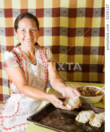 woman making meat pasty woman making meat pasty 9206187
