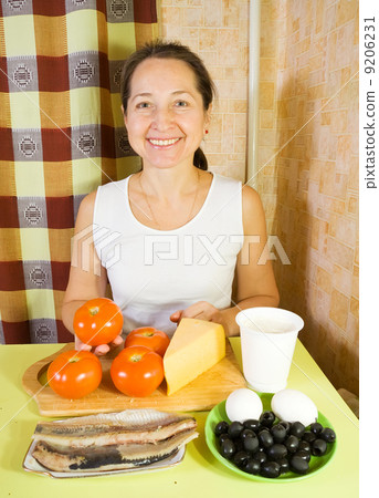 woman with ingredients for stuffed tomato salad woman with ingredients for stuffed tomato salad 9206231
