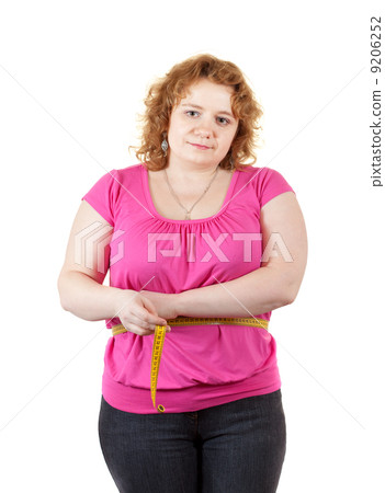 fat woman measuring waist 9206252