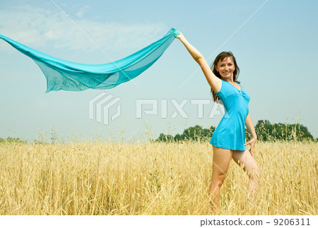 Standing girl on wheat field Standing girl on wheat field 9206311