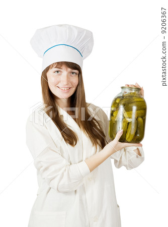 cook holding pickled cucumbers 9206367
