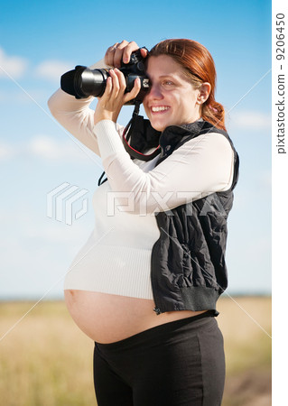 pregnant woman taking photo pregnant woman taking photo 9206450