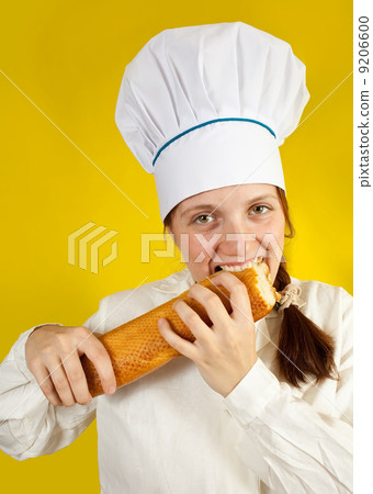female baker is testing french bread female baker is testing french bread 9206600
