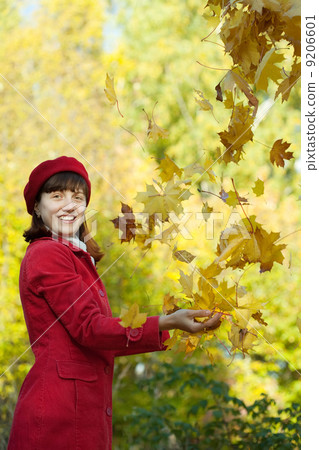 woman throwing maple in autumn woman throwing maple in autumn 9206601