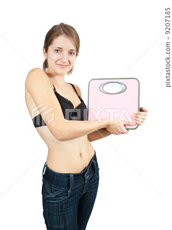 Girl holding bathroom scales Girl holding bathroom scales 9207185