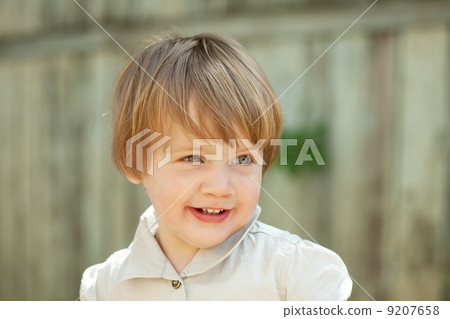 Outdoor portrait of two-year girl 9207658