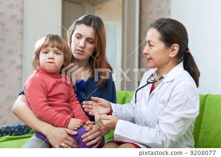 mature children's doctor examining child 9208077
