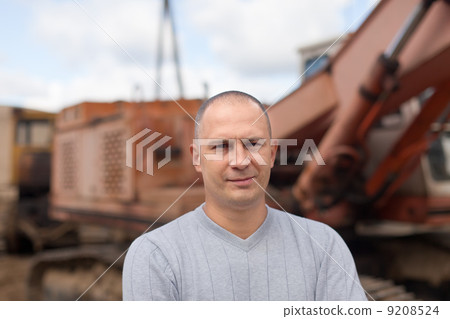 Portrait of tractor operator Portrait of tractor operator 9208524