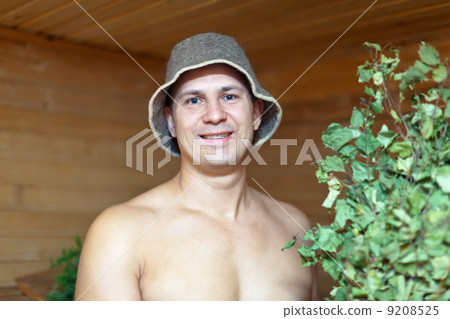Man taking steam in sauna Man taking steam in sauna 9208525