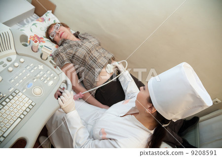 doctor making ultrasound investigation doctor making ultrasound investigation 9208591