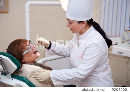Mature patient and dentist Mature patient and dentist 9208600