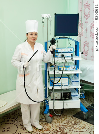 Doctor with endoscope in clinic Doctor with endoscope in clinic 9208611