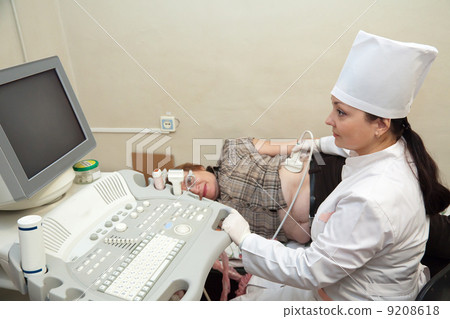 doctor making ultrasound investigation doctor making ultrasound investigation 9208618