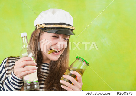female sailor with bottle of vodka and pickle 9208875