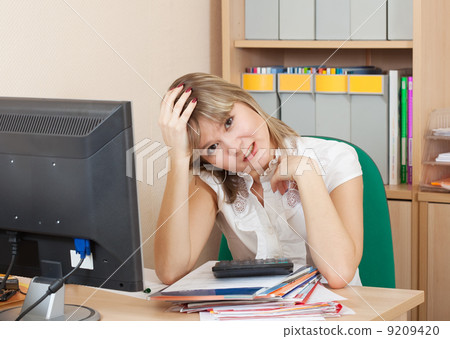 weariness woman in office 9209420