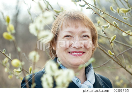 Smiling senior woman in spring 9209765