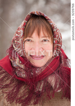 portrait of mature woman in babushka 9209766