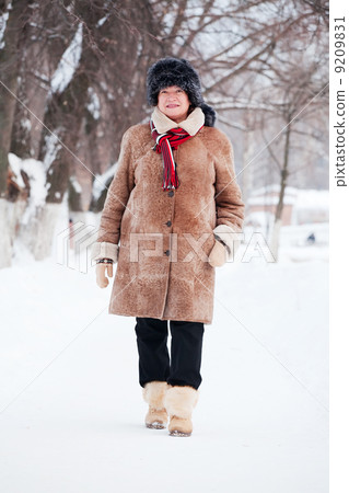 woman in coat and fur cap woman in coat and fur cap 9209831