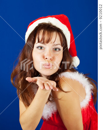 Air-kissing girl in christmas costume Air-kissing girl in christmas costume 9210012