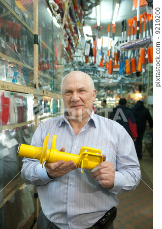 mature man in auto parts store 9210200